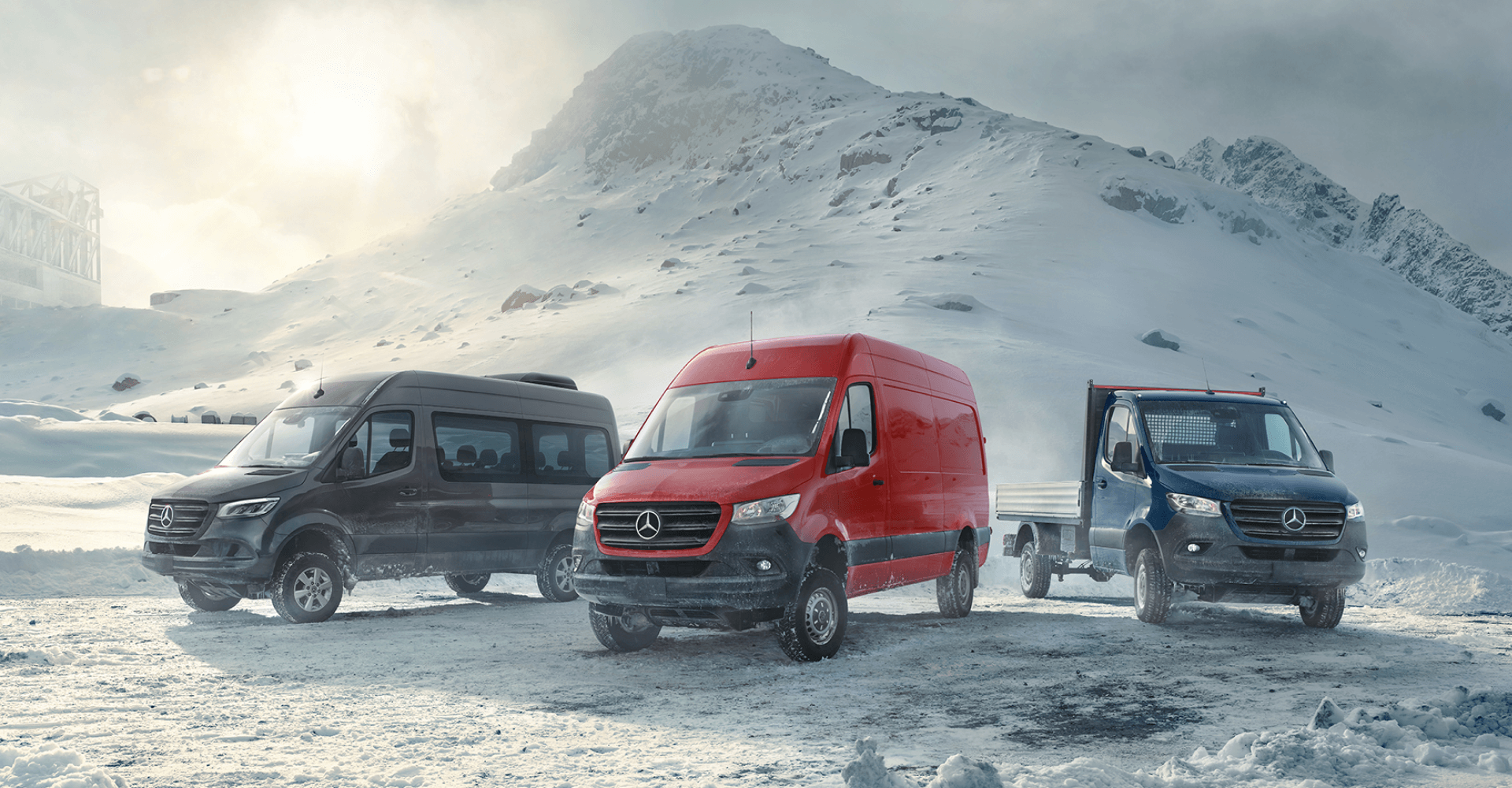 3 Mercedes Benz models on a snowcapped mountain